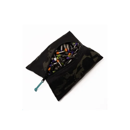 Padded camouflage pouch opened to reveal a mix of colorful batteries spilling out.