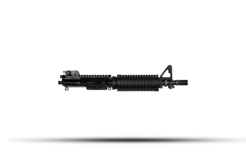 Side view of a black tactical rifle with a rail system on a white background, lying horizontally to the left to right.