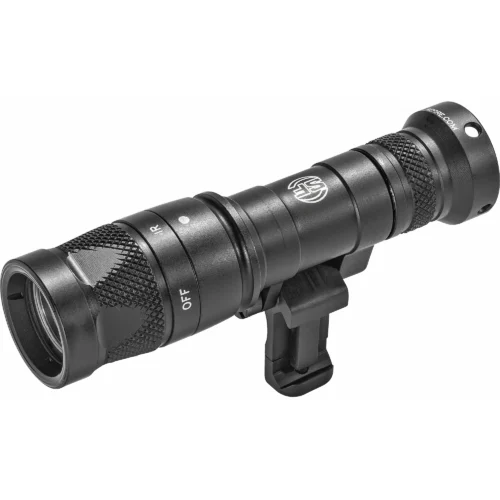 Close-up of a black tactical flashlight with knurled grip mounted on a rail, showing an OFF label and lens at left edge