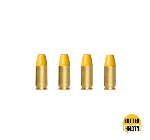 Row of five yellow bullet tips with gold casings on a white background; bottom-right shows a dripping yellow circle logo reading 'BUTTER SHOTS'.