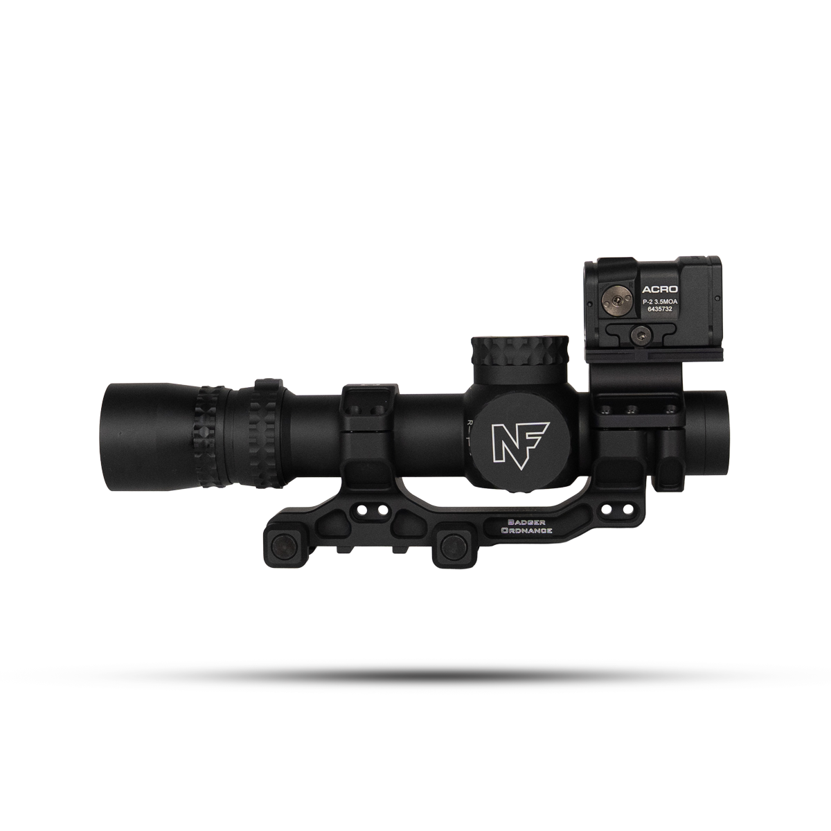 Black tactical rifle scope with a side-mounted Acro red dot sight and rail mount, shown in mid-air.