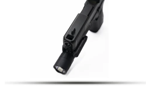 Close-up of a black semi-automatic pistol barrel and slide against a white background.