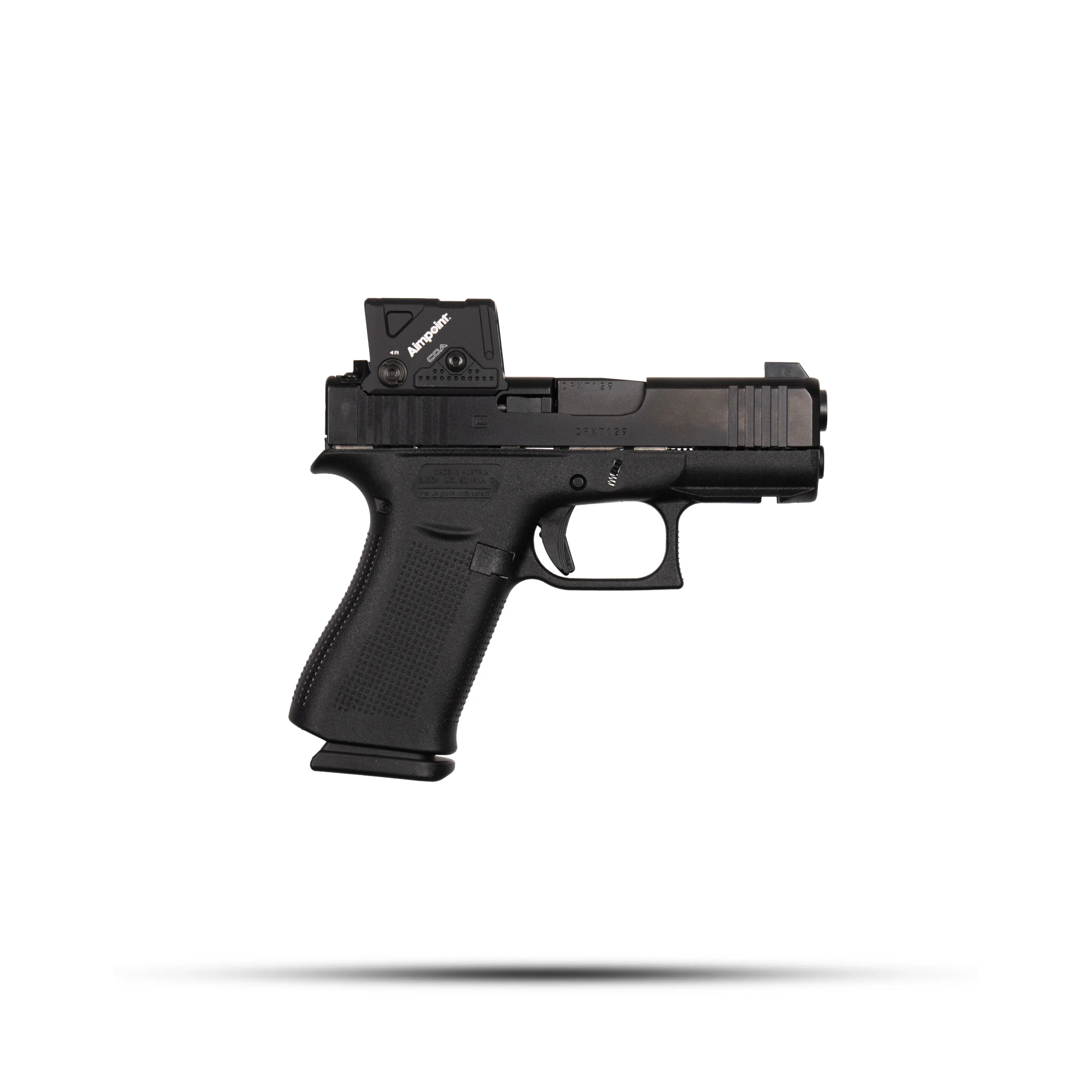 43xside – Badlands Munitions Co Black semi-automatic pistol in side view with textured grip and mounted optic sight on the slide.