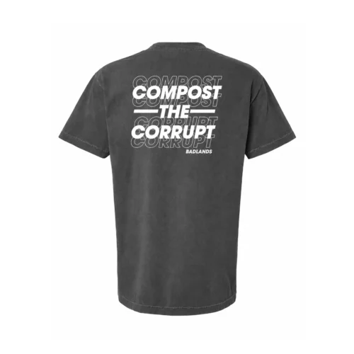 Back view of a dark gray T-shirt with large stacked 'COMPOST' text in white, repeated in outline behind the solid white text.