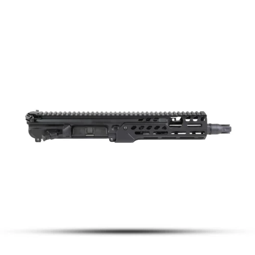 Close-up of a black rifle upper receiver with a long Picatinny rail along the top and slots on the side.