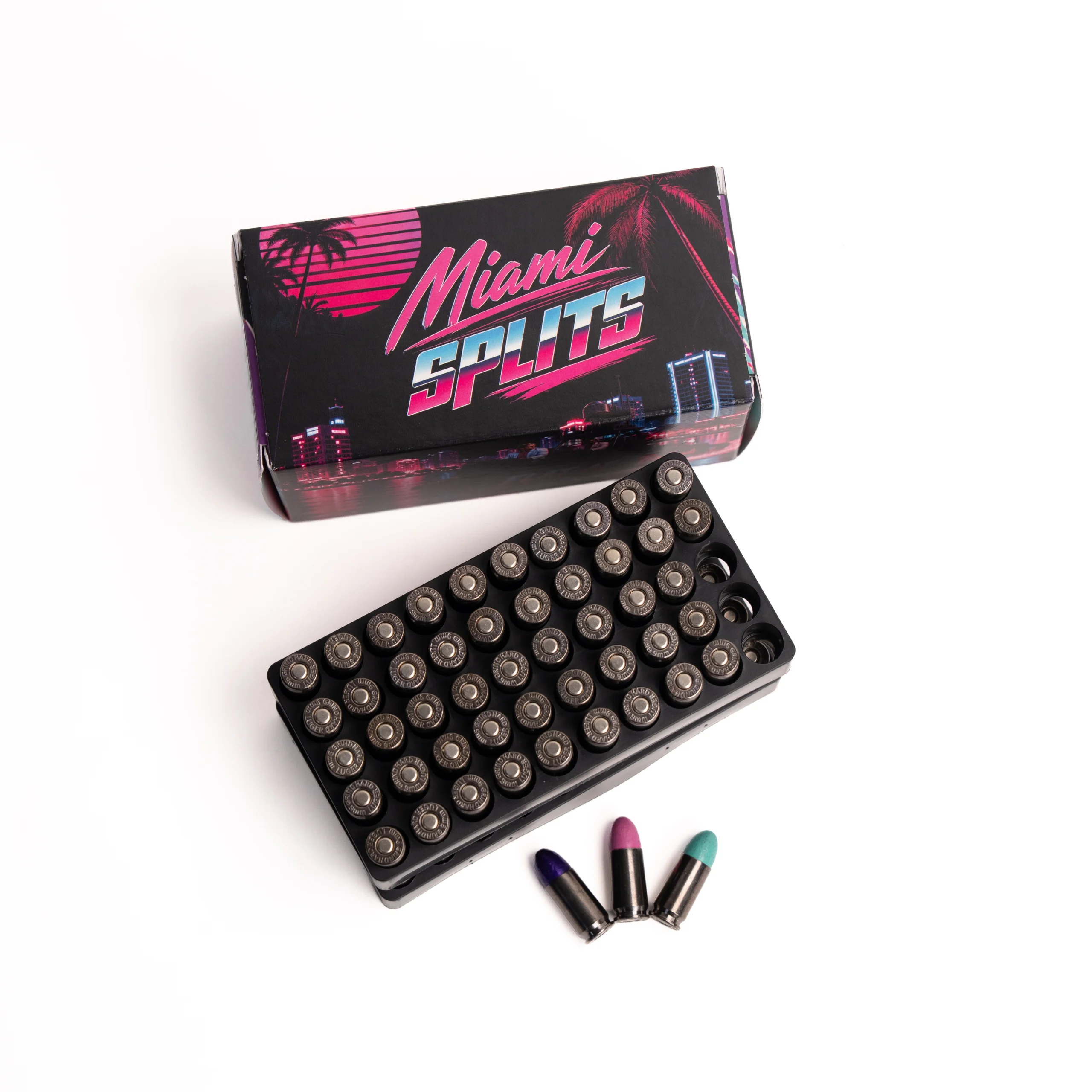 M7 – Badlands Munitions Co Boxed makeup set with a retro Miami Lights graphic and rows of circular lipstick bullets nearby